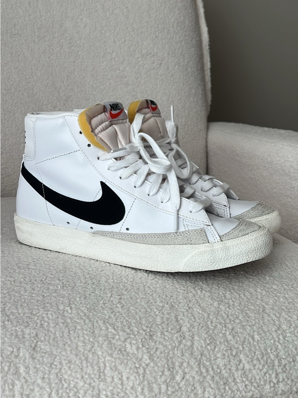 Nike White High-Top Sneakers with Black Swoosh